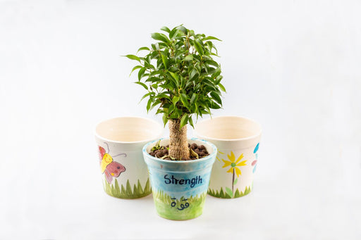 Plant pot decorated by kids drawings (to support the treatment of cancer patients) exxab.com